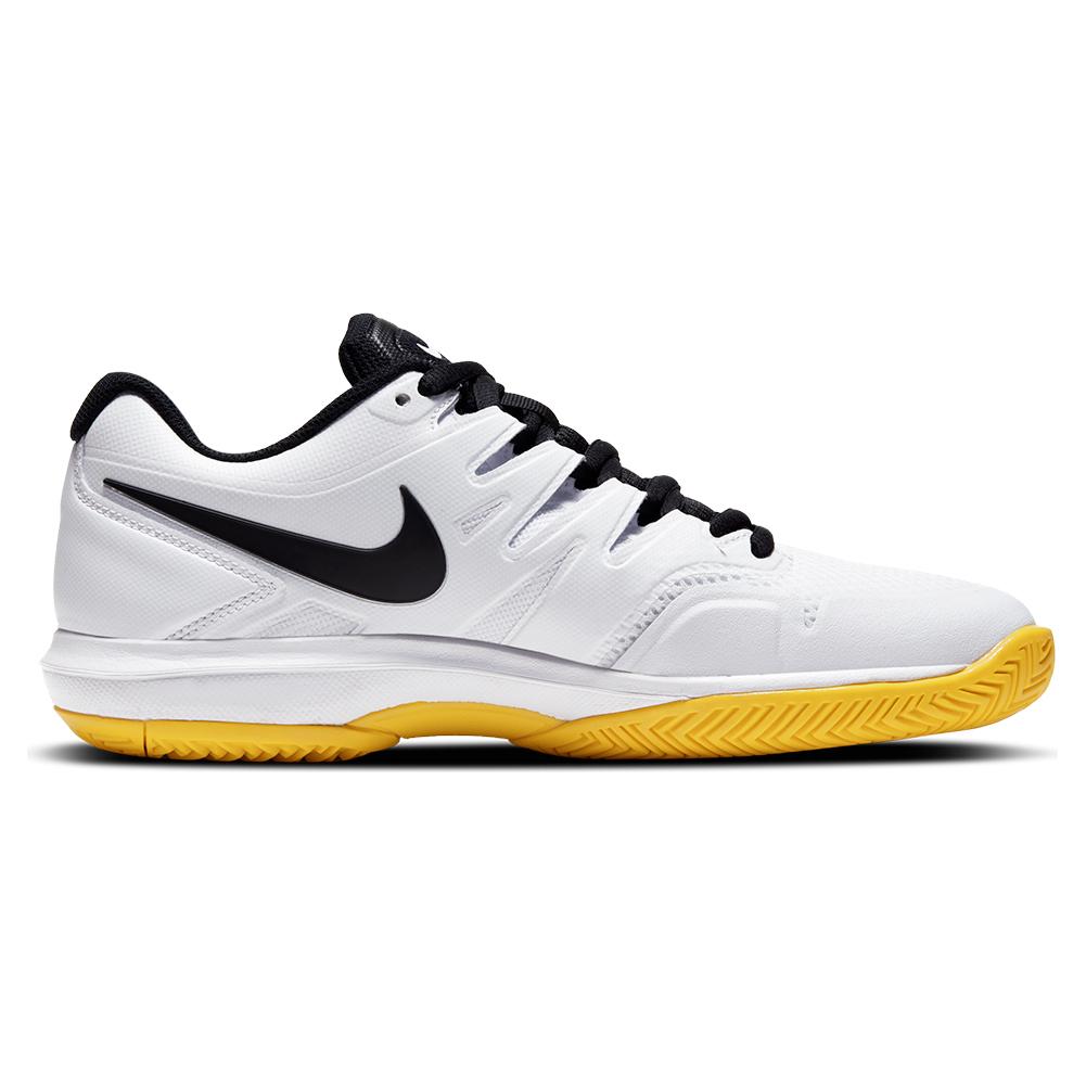 white and yellow tennis shoes